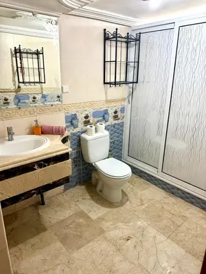a bathroom with a toilet and a sink at Fabuleux appartement au Centre Ville avec Wifi 100 Mo in Fès