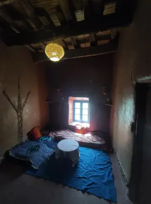 a small room with a bed and a window at Casa Rural Todra Gorges in Tinerhir