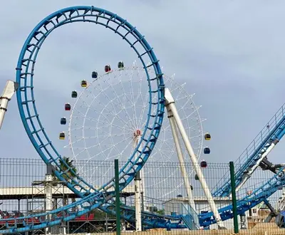 a large ferris wheel with people riding on it at Meknes centre ville Appartement neuf moderne et bien équipé in Meknès