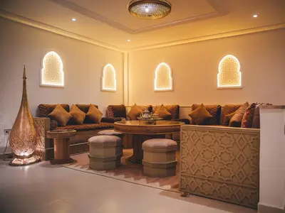 a living room with a couch and a table at Villa SUNSET Marrakech in Marrakech