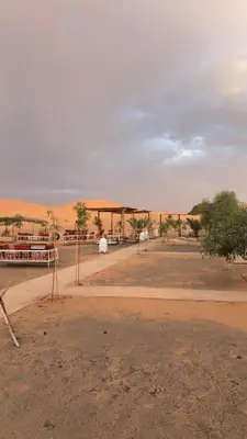 an empty road in the middle of a desert at Desert luxury in Merzouga
