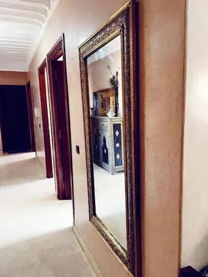 a mirror on a wall in a room at Bel appartement 2 chambres au cœur de Marrakech in Oulad Akkou