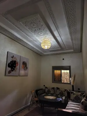 a living room with a coffered ceiling and a table at Blue Palm apartment in Ouarzazate