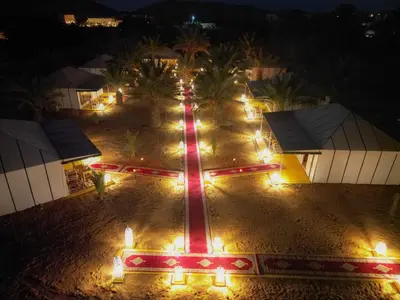 an aerial view of a street at night with lights at Sahara Experience Luxury Camp in Merzouga