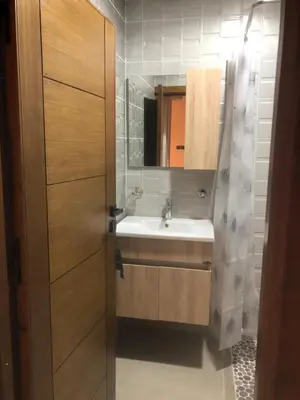 a bathroom with a sink and a mirror at Apartement in saada fez in Fès