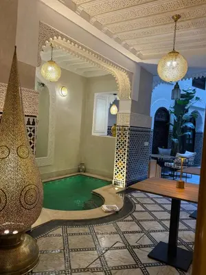 a home with a swimming pool in a room at Riad Citronnier & Spa in Fès