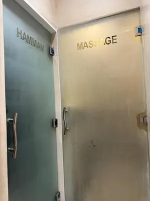 a metal door with the massage sign on it at Riad Citronnier & Spa in Fès
