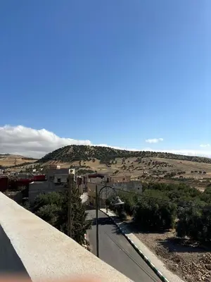 a view of a city from a bridge at Maison Merzouka - Rustic Stay in the Taza Countryside
