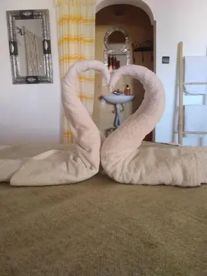 a pair of swan chairs in front of a mirror at L'oasis Du Bonheur in Aït Ben Haddou