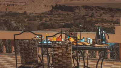 a table with food on it with a view at L'oasis Du Bonheur in Aït Ben Haddou