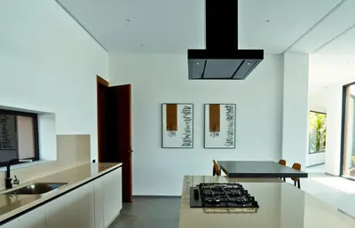 a kitchen with a sink and a stove in it at Villa Timenkar - Moroccan spa and mountain panorama in Aghmat