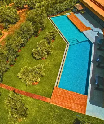 an overhead view of a swimming pool in a yard at Villa Timenkar - Moroccan spa and mountain panorama in Aghmat