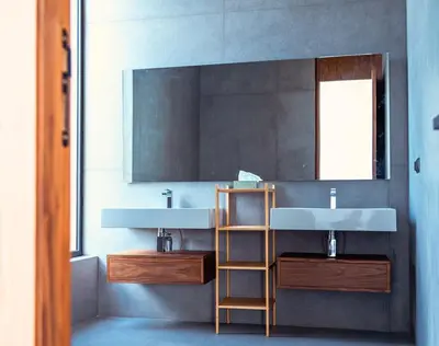a bathroom with two sinks and a mirror at Villa Timenkar - Moroccan spa and mountain panorama in Aghmat