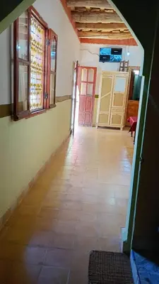 an empty room with a hallway with a door and a floor at Riad hotel Étoile dades Camping in Aït Ali Ou Allah