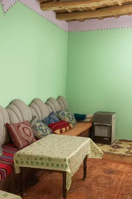 a living room with a couch and a table at Riad hotel Étoile dades Camping in Aït Ali Ou Allah