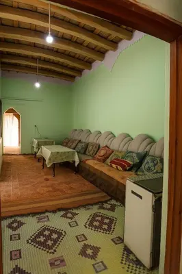 a large room with a couch and a table at Riad hotel Étoile dades Camping in Aït Ali Ou Allah