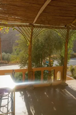a view of a pavilion with a water fountain at Riad hotel Étoile dades Camping in Aït Ali Ou Allah