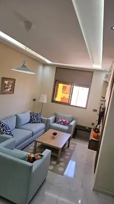a living room with couches and a coffee table at 2 bedroom apartment, low price & comfort in Oulad Akkou