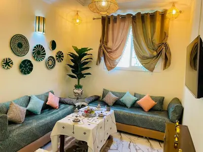 a living room with a couch and a table at Traditional Apartment in Heart of Old Medina in Fès