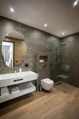 a bathroom with a sink and a toilet and a shower at Villa B Marrakech Chambre d hôtes Guest House Adult Only piscine privée zéro vis à vis in Marrakech