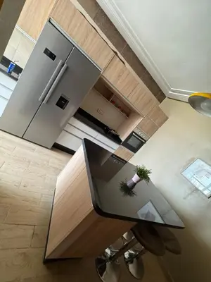 an overhead view of a kitchen with a table and refrigerator at Fleury in Fès