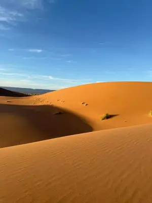 a sand dune in the middle of a desert at mhamid luxury camps in Mhamid El Ghizlane