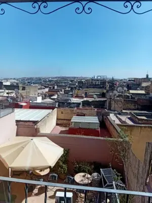 a view of a city from the roof of a building at Riadnomadfes in Fès