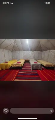 a screen shot of a tent with two beds at Dar chez ali in Mhamid