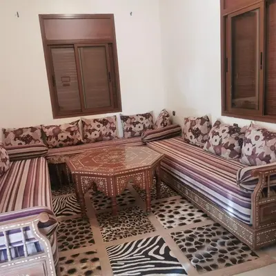 a living room with a couch and a table at dar hammouni