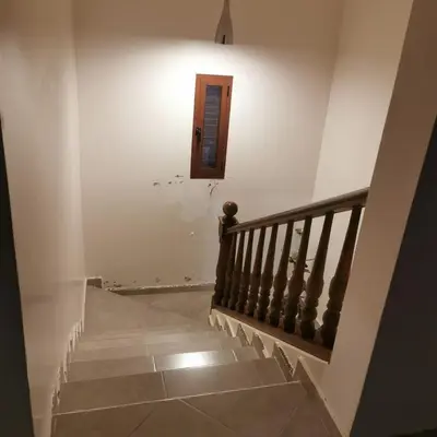 a staircase in a house with a door and a window at dar hammouni