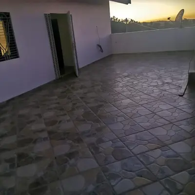 a room with a stone floor and a wall at dar hammouni