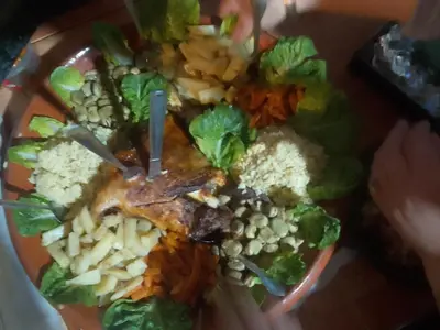 a plate of food with lettuce and vegetables on it at Dar dmana chez l'habitant in Skoura