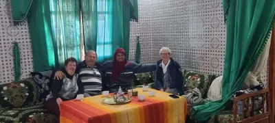 a group of people sitting around a table at Dar dmana chez l'habitant in Skoura