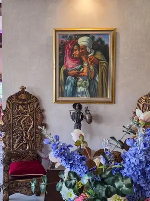 a painting of a woman with a child on a wall at Dar Muskana