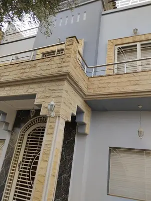 an external view of a building with a balcony at Villa in Meknès
