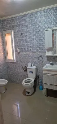 a bathroom with a toilet and a sink at Villa in Meknès