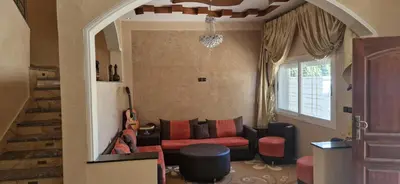 a living room with a couch and a chair at Villa in Meknès