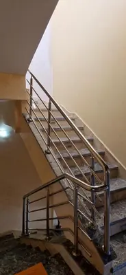 a set of metal stairs in a building at Villa in Meknès