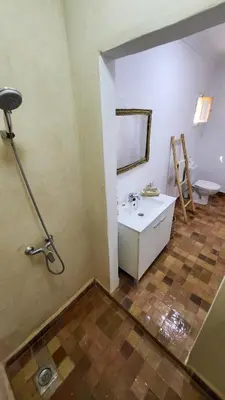 a bathroom with a sink and a toilet at Tawenza Lodge in Aït Ourir