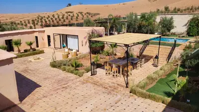 an aerial view of a house with a patio and a pool at Tawenza Lodge in Aït Ourir