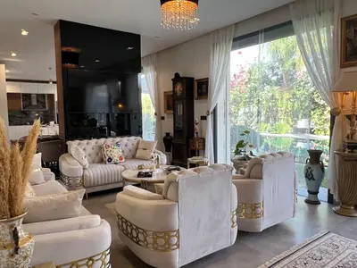a living room with white furniture and a large window at Villa Fiori Luxury Italian Villa, Pool & Spa, Marrakech in Douar bel Rhanodour