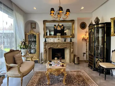 a living room with a fireplace and a mirror at Villa Fiori Luxury Italian Villa, Pool & Spa, Marrakech in Douar bel Rhanodour