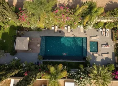 an overhead view of a swimming pool in a resort at Villa Fiori Luxury Italian Villa, Pool & Spa, Marrakech in Douar bel Rhanodour