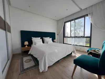 a bedroom with a large bed and a large window at Villa Fiori Luxury Italian Villa, Pool & Spa, Marrakech in Douar bel Rhanodour