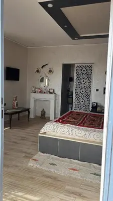 a bedroom with a large bed and a mirror at Villa 2 houses, pool, nature view