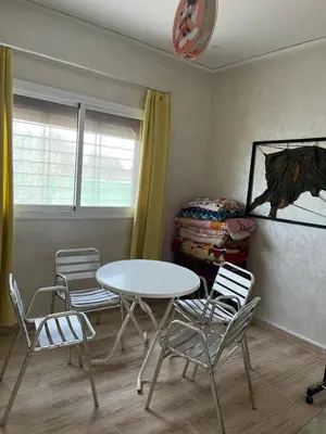 a dining room with a table and chairs in a room at Villa 2 houses, pool, nature view