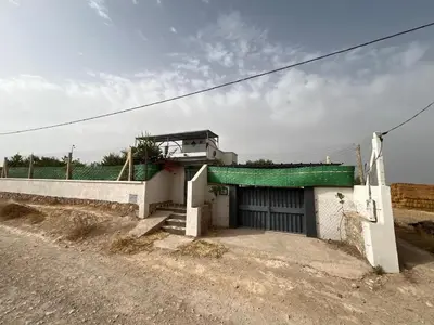 a small white building with a green roof at Villa 2 houses, pool, nature view