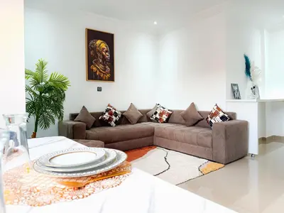 a living room with a couch and a table at Fib Houses in Ouarzazate
