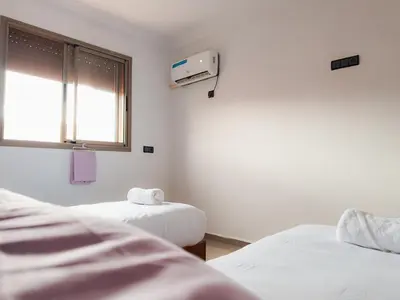 a hospital room with two beds and a window at Fib Houses in Ouarzazate