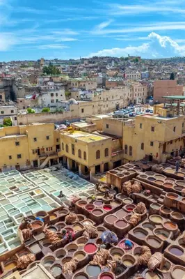 an overhead view of a city with umbrellas and buildings at Bedroom in medina in Fès